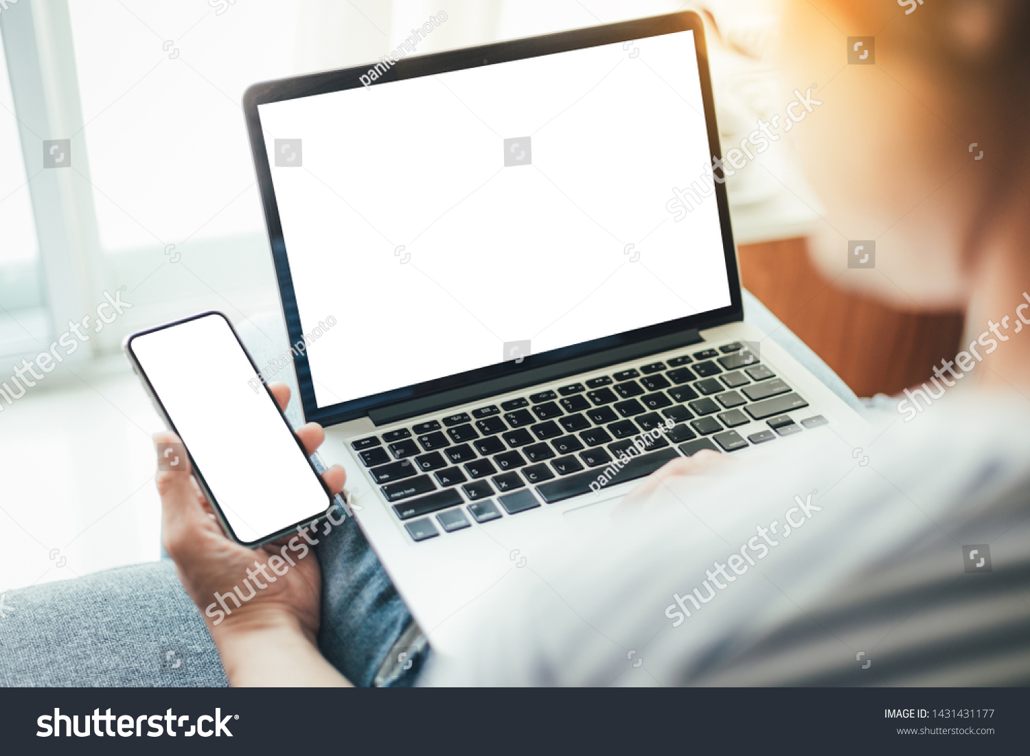 mockup image blank screen computer cell phone with space for advertising text hand using laptop texting mobile contact business searching information in workplace desk in office.design creative work