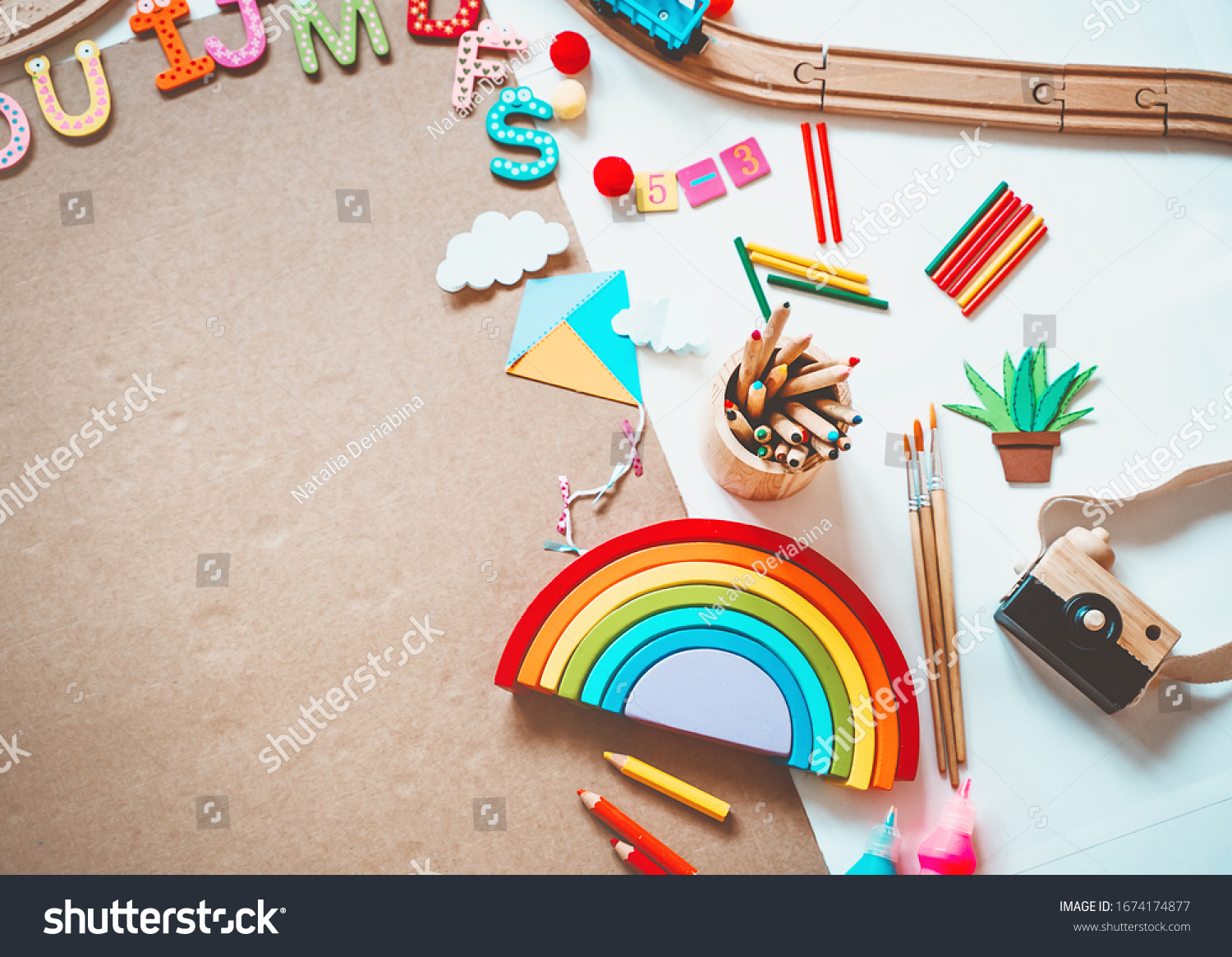 Background for preschool or kindergarten or art classes. Kids educational toys and school supplies for draw and make DIY crafts. Flat lay top view. Art child frame with empty paper mock up for text