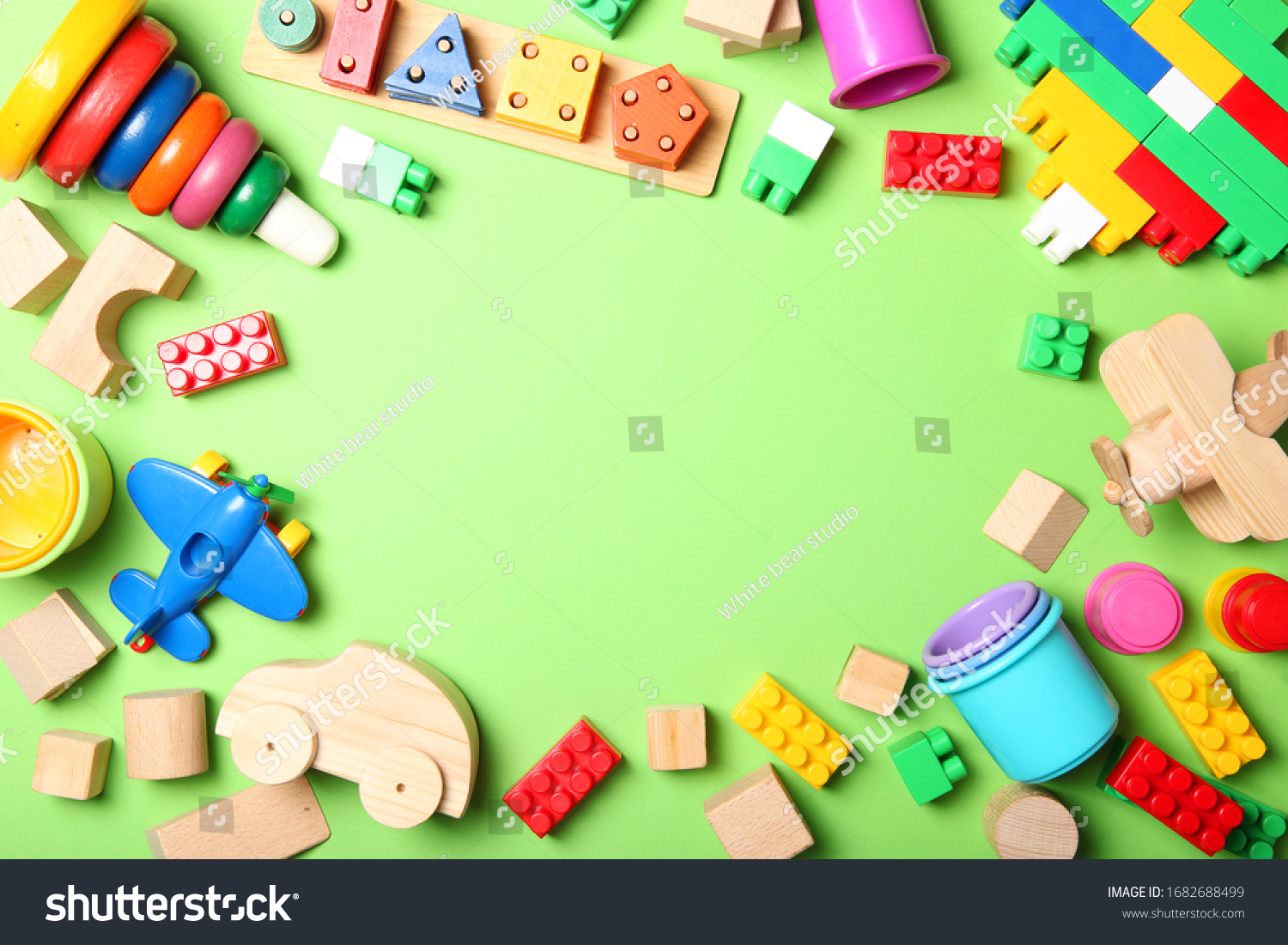 Set of different children's toys on a colored background top view. A place to insert text minimalism. Baby background.