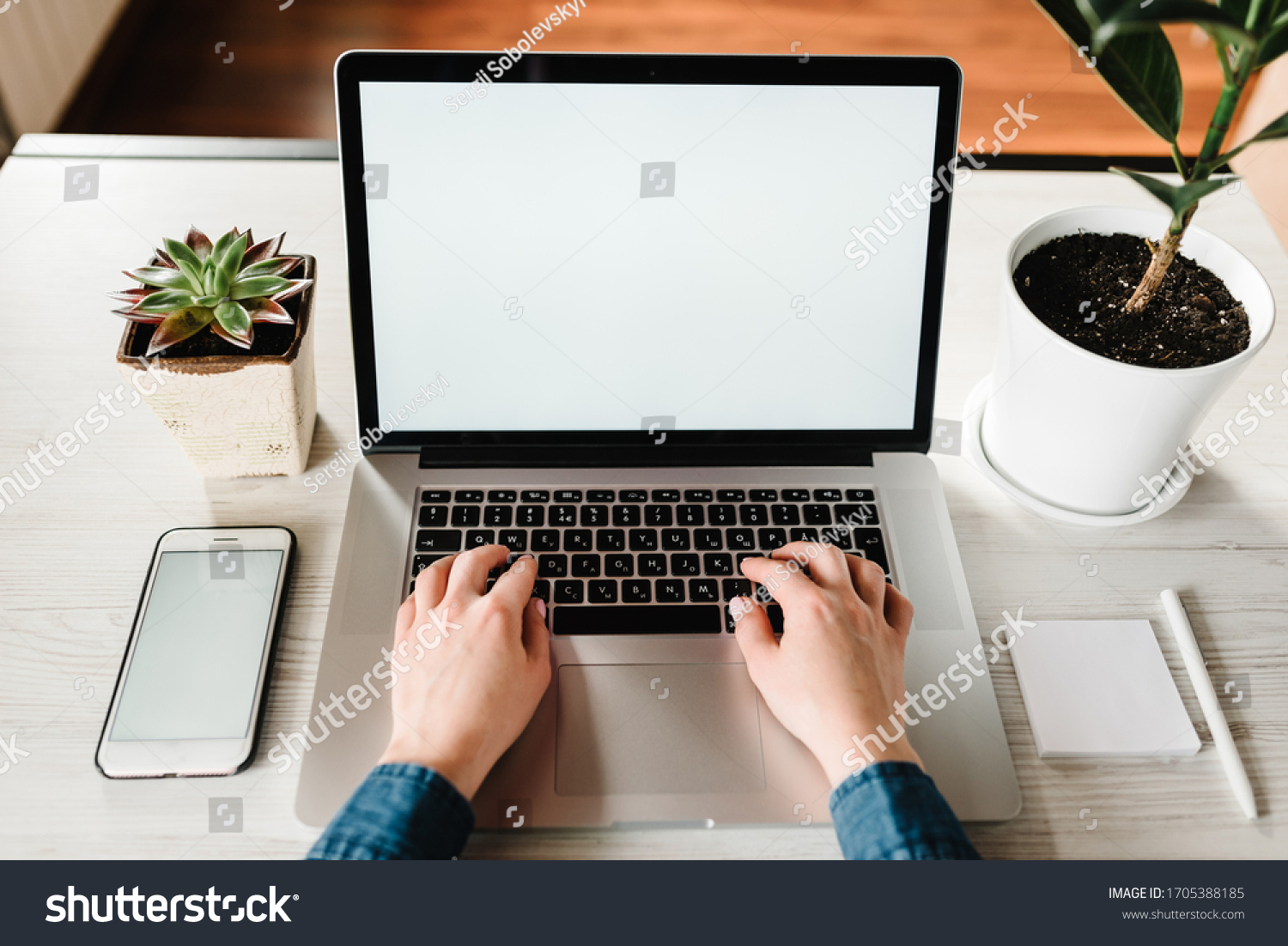 Mockup image blank screen laptop computer cell phone with white background for advertising text. Hands woman using laptop on table. Writing typing. Freelance concept. Work home. Marketing design.