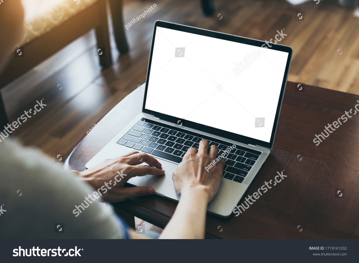 computer mockup image blank screen with white background for advertising hand woman work using laptop contact business search information on desk at coffee shop.marketing and creative design