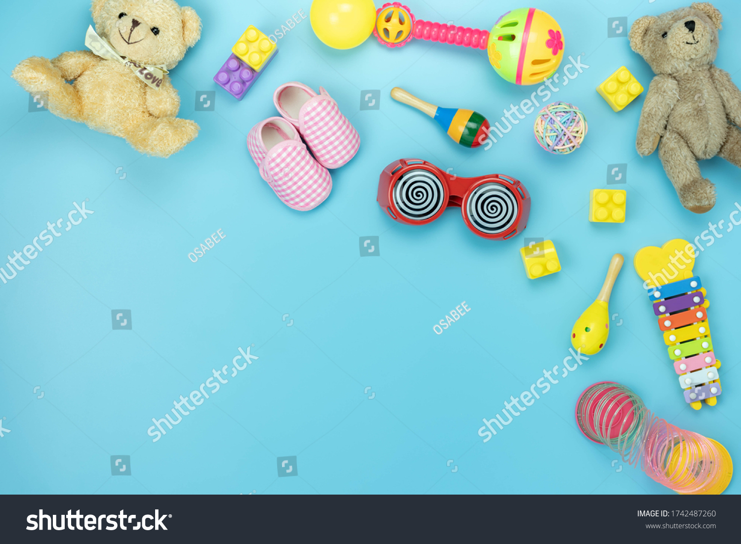 Table top view decoration kid toys for develop background concept.Flat lay accessories baby to play with items child on modern blue paper at office desk.Copy space for add text.pastel tone wallpaper.