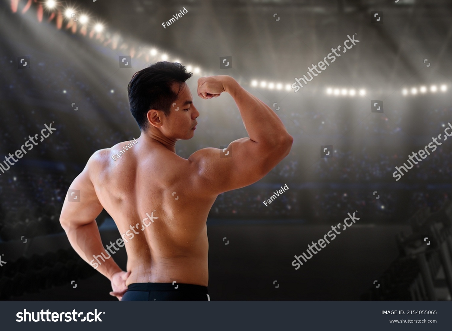 Man exercising in gym. Asian bodybuilder lifting weights. Sport and healthy activity for young male. Active Chinese athlete in training. Body building exercise work out.