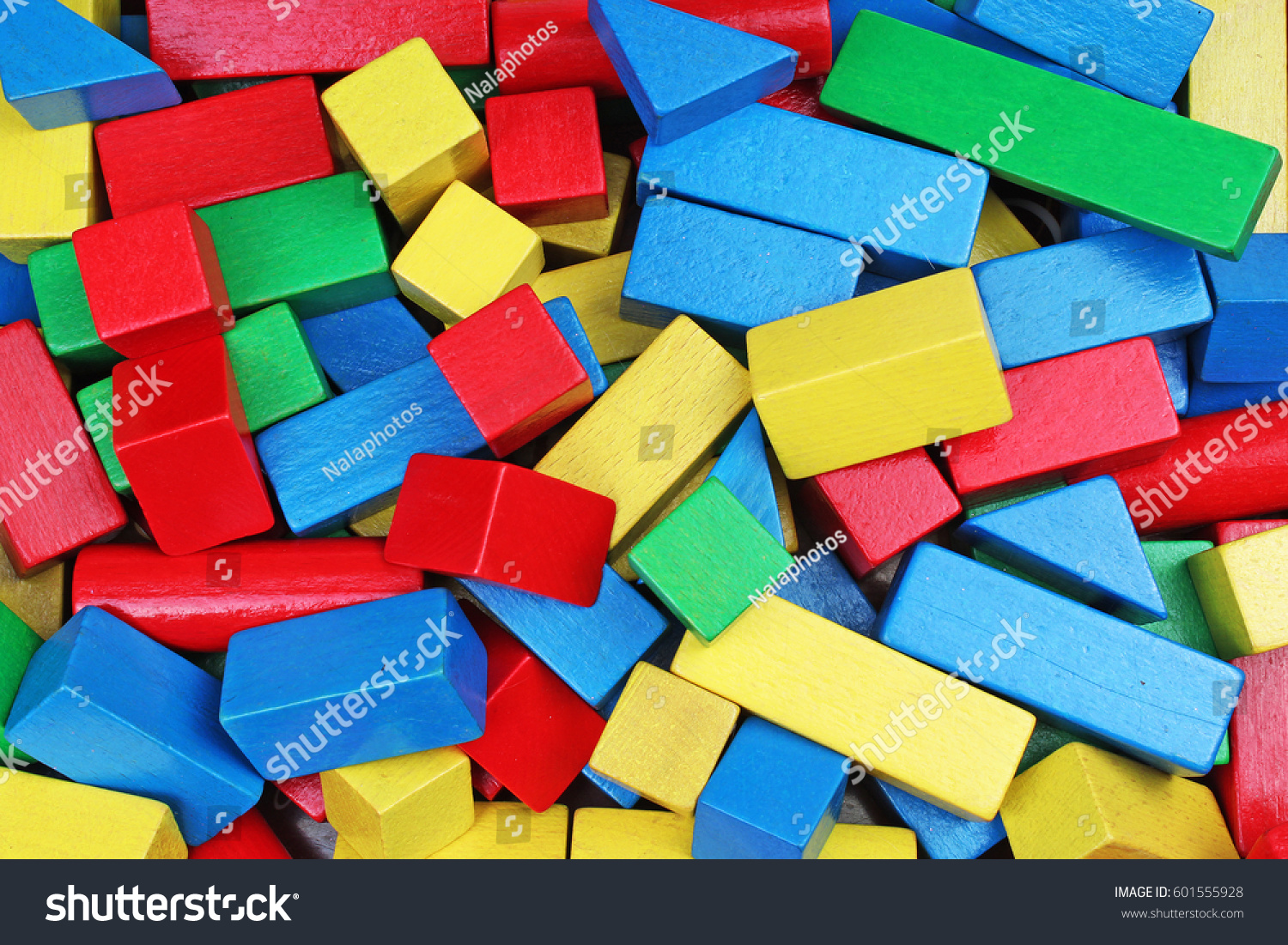 Wooden toy background. Red Blue Yellow Green Wooden toy blocks on white background. Wood block texture pattern.
