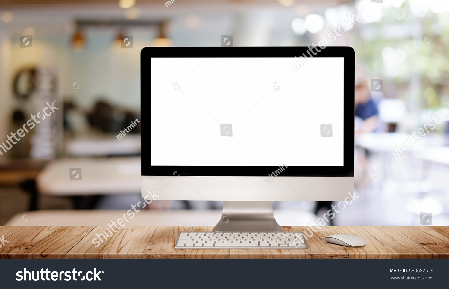 Work place concept : Mock up Blank screen computer desktop with keyboard in cafe or co-working background.