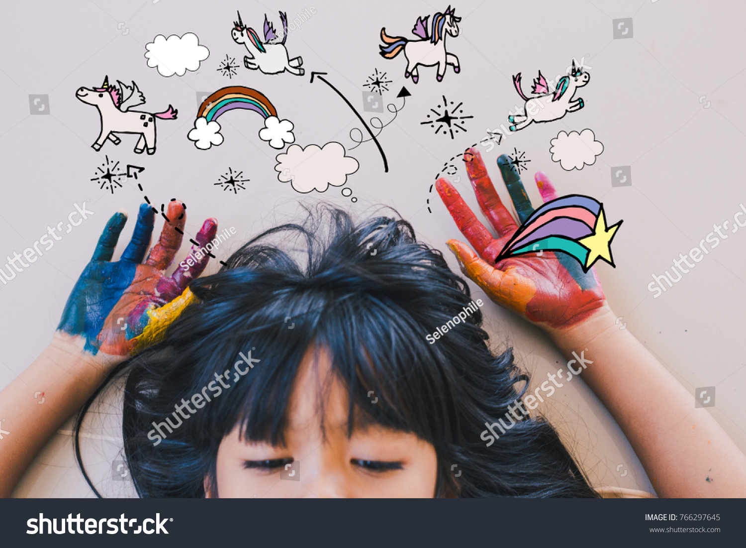 Education art and creativity learning concept - A black long hair asian student put her colourful hands painting up