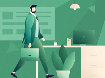 拎着公文包的商务人士走在办公桌前