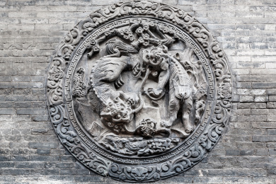 山西省平遥古城清代古民居马家大院内的灰砖墙砖雕