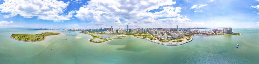 Panorama View. Haikou City Skyline with Office Buildings, Yacht Marina, Container Port and Public Parks. Hainan Province, China. 