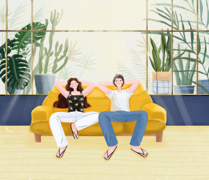 一对情侣坐在室内的沙发上晒太阳