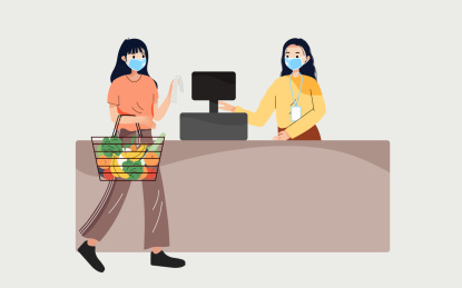 在超市买菜正在付款收银的女生