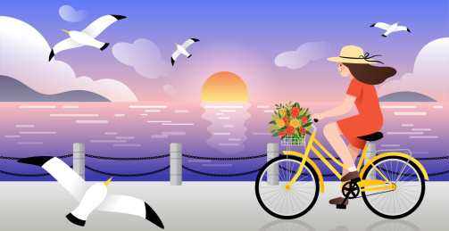 海边日落背景下一个女孩骑着自行车