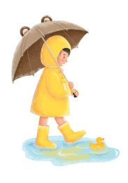 小男孩穿着雨衣雨鞋在水坑里玩耍