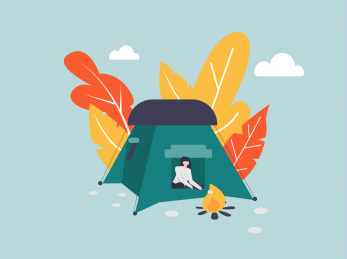 一个女生坐在帐篷里烤肉