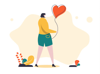 女孩拿着爱心形状气球