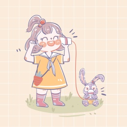 黄色背景下玩打电话游戏的女孩