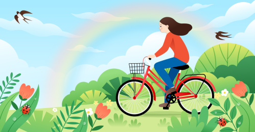 一个女生在户外骑自行车和自然植然背景