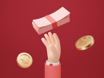 手伸向一叠红色钞票创意金融素材