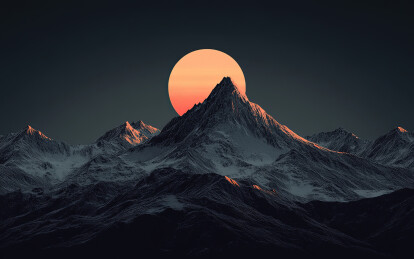 日落时白雪皑皑的群山景色